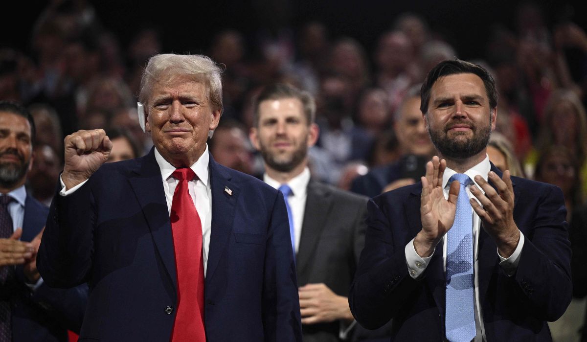 Donald Trump raises a fist next to US Senator from Ohio and 2024 Republican vice-president candidate JD Vance during the first day of the 2024 Republican National Convention at the Fiserv Forum in Milwaukee, Wisconsin, on July 15, 2024 | AFP