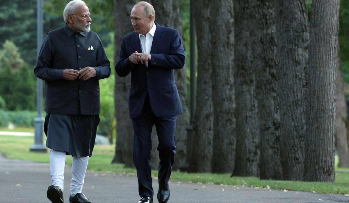 Russia's President Vladimir Putin and Prime Minister Narendra Modi take a walk during an informal meeting at the former's Novo-Ogaryovo state residence | AFP via Sputnik