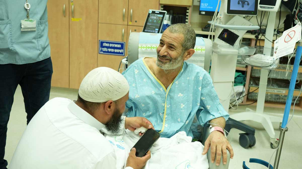 Farhan al-Qadi, who was held hostage by Hamas militants in Gaza sits in a room at the Soroka Medical Center in Beersheba | AFP