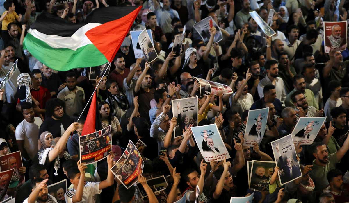 Demonstrators take part in a symbolic funeral for Hamas leader Ismail Haniyeh who was killed in Iran, in Amman | Reuters