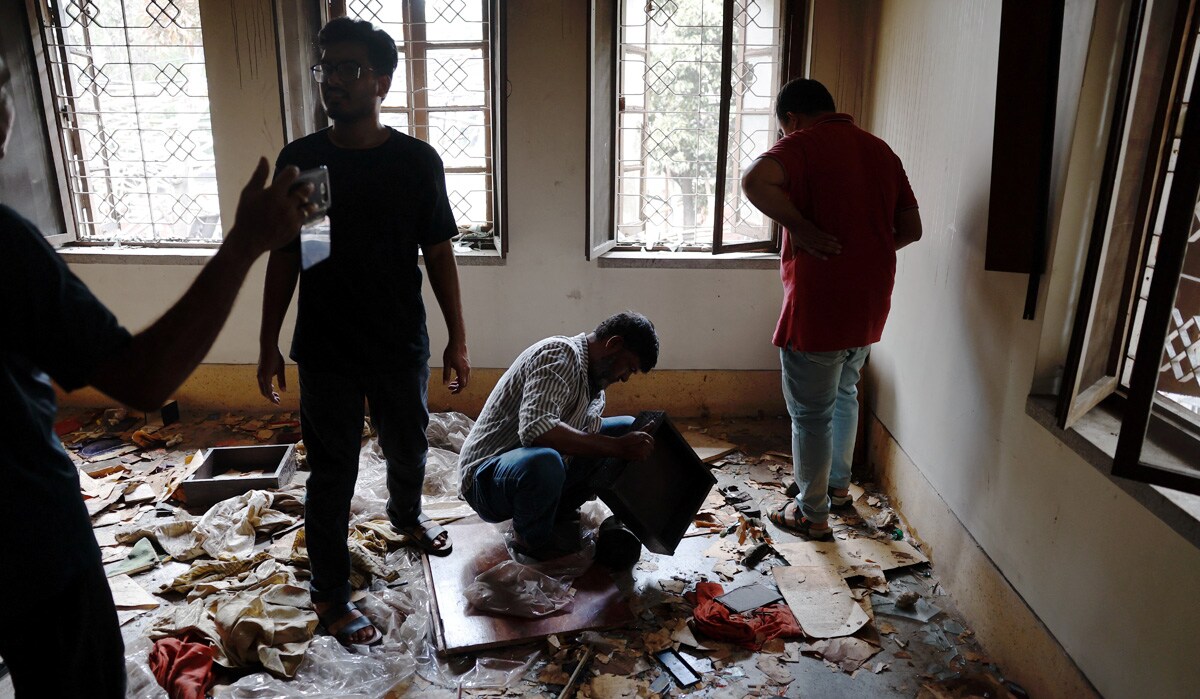 People visit the Bangabandhu Sheikh Mujibur Rahman Memorial Museum, which was vandalised after the resignation of Bangladeshi Prime Minister Sheikh Hasina, in Dhaka, Bangladesh, August 6, 2024. REUTERS/Mohammad Ponir Hossain
