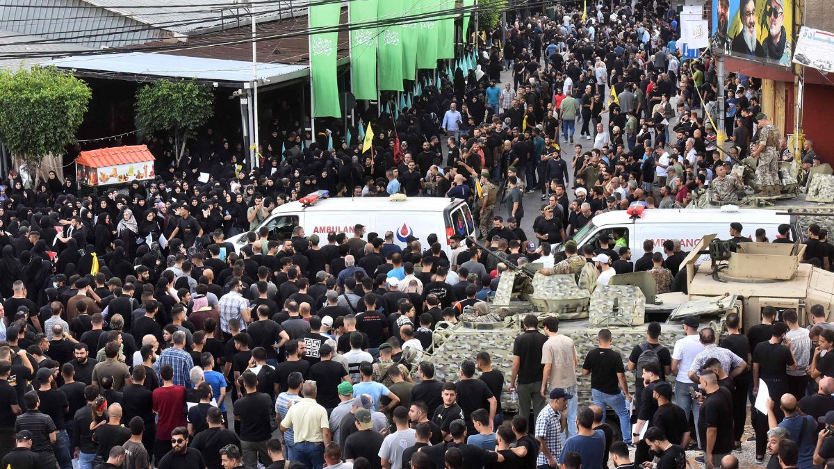 Ambulances arrive after a reported device explosion occurred during the funeral of people killed when hundreds of paging devices exploded in a deadly wave across Lebanon the previous day, in Beirut's southern suburbs on September 18, 2024 | AFP