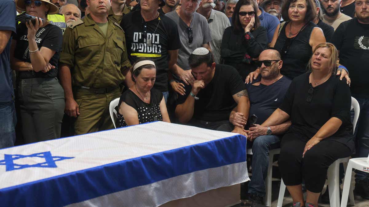  Relatives and friends attend the funeral of Alexander Lobanov, whose body was among six recovered from the Gaza Strip | AFP