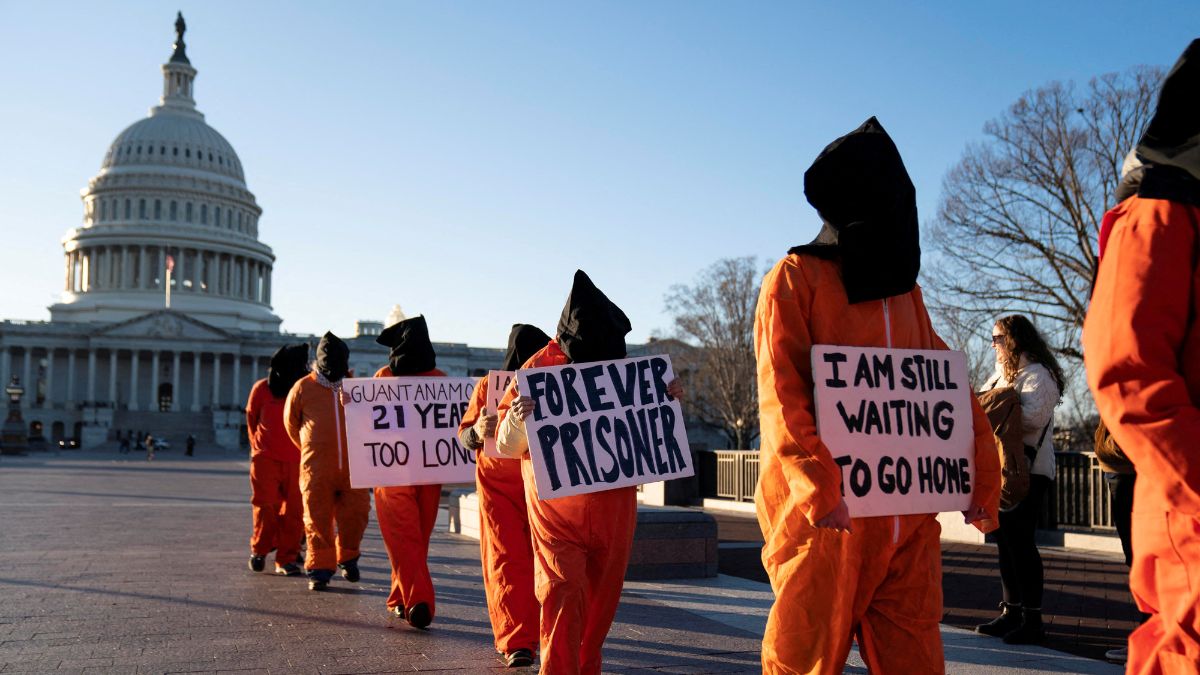 A group of people dressed as prisoners protest Guantanamo Bay Detention Camp outside of the U.S. Capitol in Washington, D.C., U.S., January 9, 2023 | Reuters