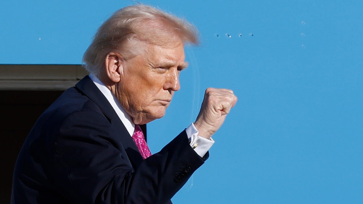 President Donald Trump gestures from the stairs of Air Force One as he boards upon his arrival at Joint Base Andrews, Md. | AP/PTI