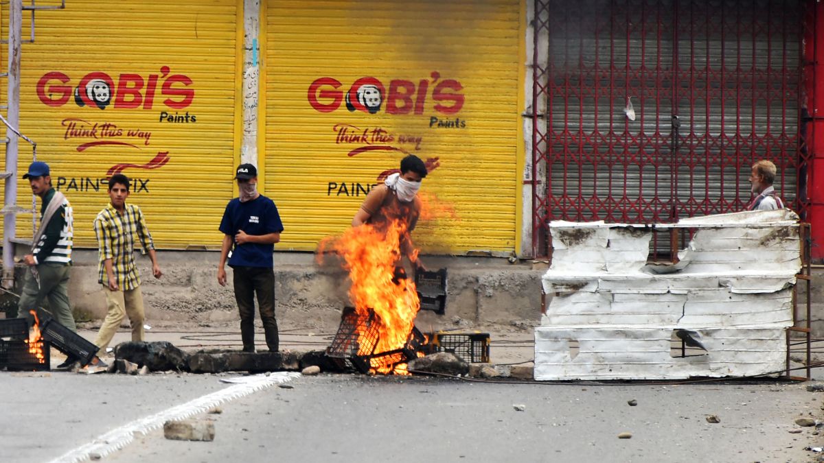 Awami Action Committee (AAC) activists block a road during a demonstration in Muzaffarabad, capital of Pakistan-occupied Kashmir | AFP 