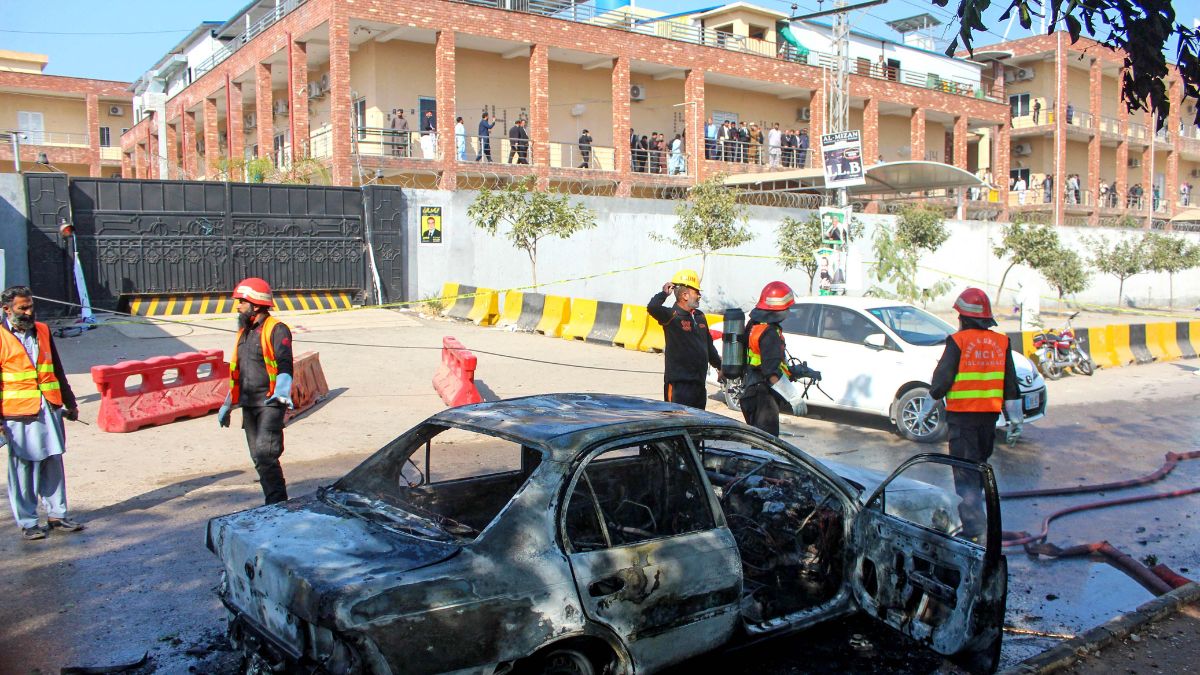 Firefighters douse a car at the suicide blast site in Islamabad on November 11, 2025 | AFP