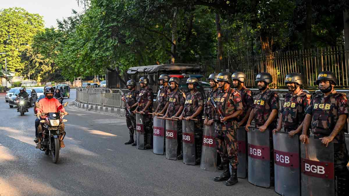 BGB personnel stand guard along a road in Dhaka | AFP