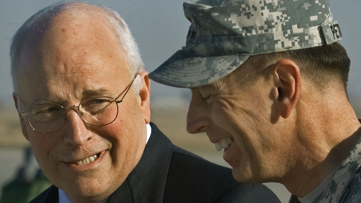 US Vice President Dick Cheney (L) confers with US General David Patraeus (R) moments after Cheney's arrival in an unannounced visit to Baghdad, Iraq on March 17, 2008. Former US vice president Dick Cheney has died aged 84, US media reported on November 4, 2025, citing a statement from his family. (Photo by Paul J. RICHARDS / AFP)