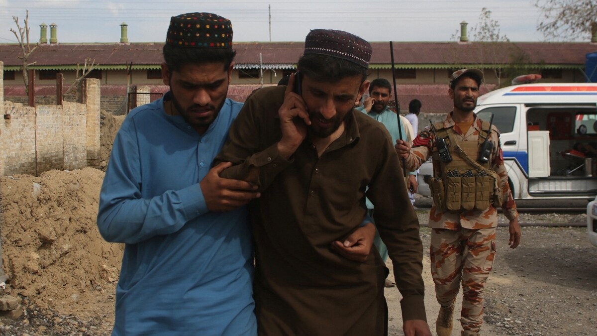 Plain clothes security force perosnnel, who were rescued from a train after it was attacked by separatist militants, leave Mach railway station in Mach, Balochistan | Reuters