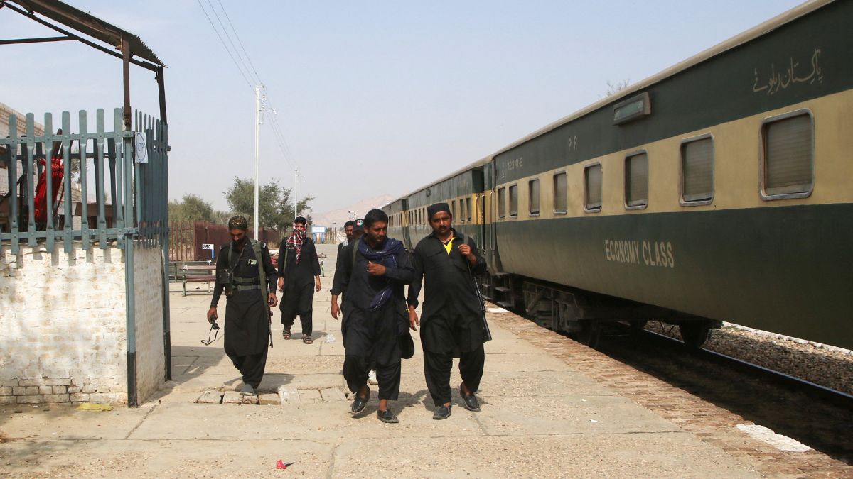 Police officers walk next to a rescue train, after the attack on a train by separatist militants in Bolan, at the Railway Station in Mushkaf, Balochistan, Pakistan, March 12, 2025 | Reuters