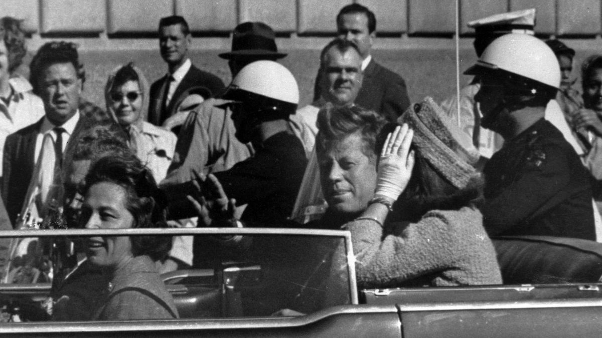 This Nov. 22, 1963 file photo shows President John F. Kennedy riding in motorcade with first lady Jacqueline Kenndy in Dallas | AP