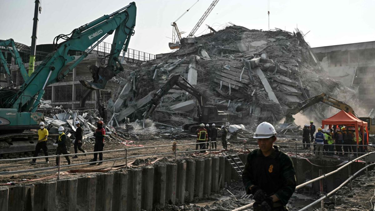 Rescue teams trying to rescue people trapped in the rubble after a construction building collapsed in Bangkok following the earthquake | AFP
