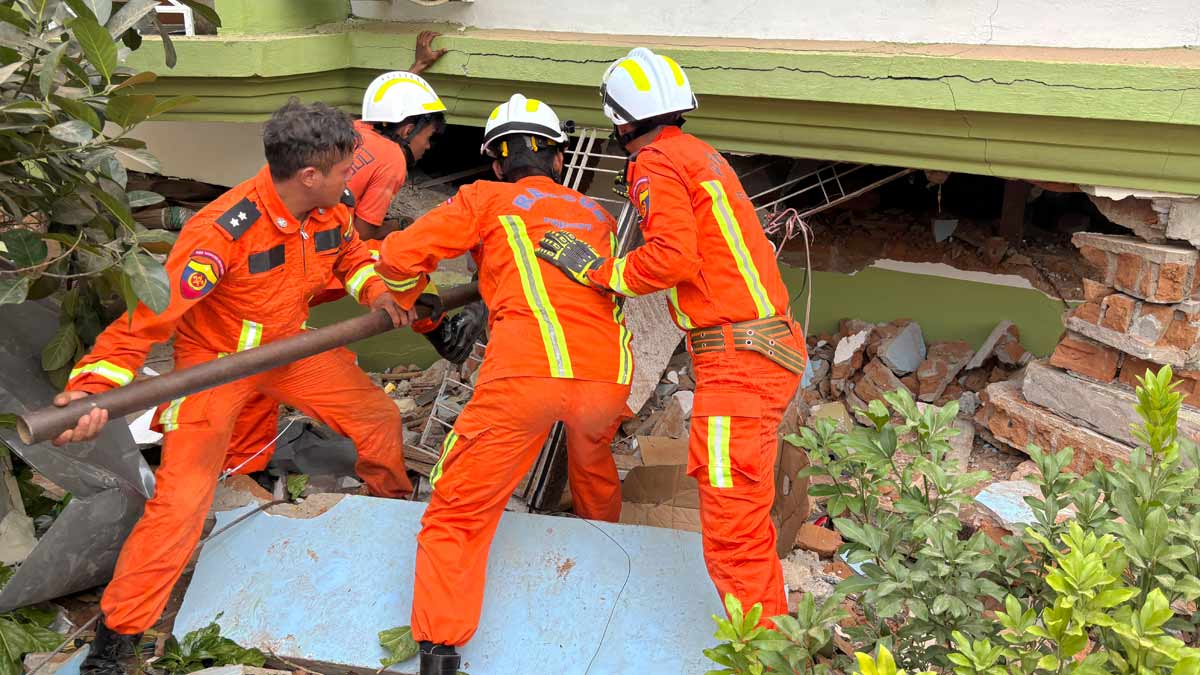 Myanmar rescuers search for survivors of Friday's earthquake beneath a damaged building in Naypyitaw, Myanmar | AP