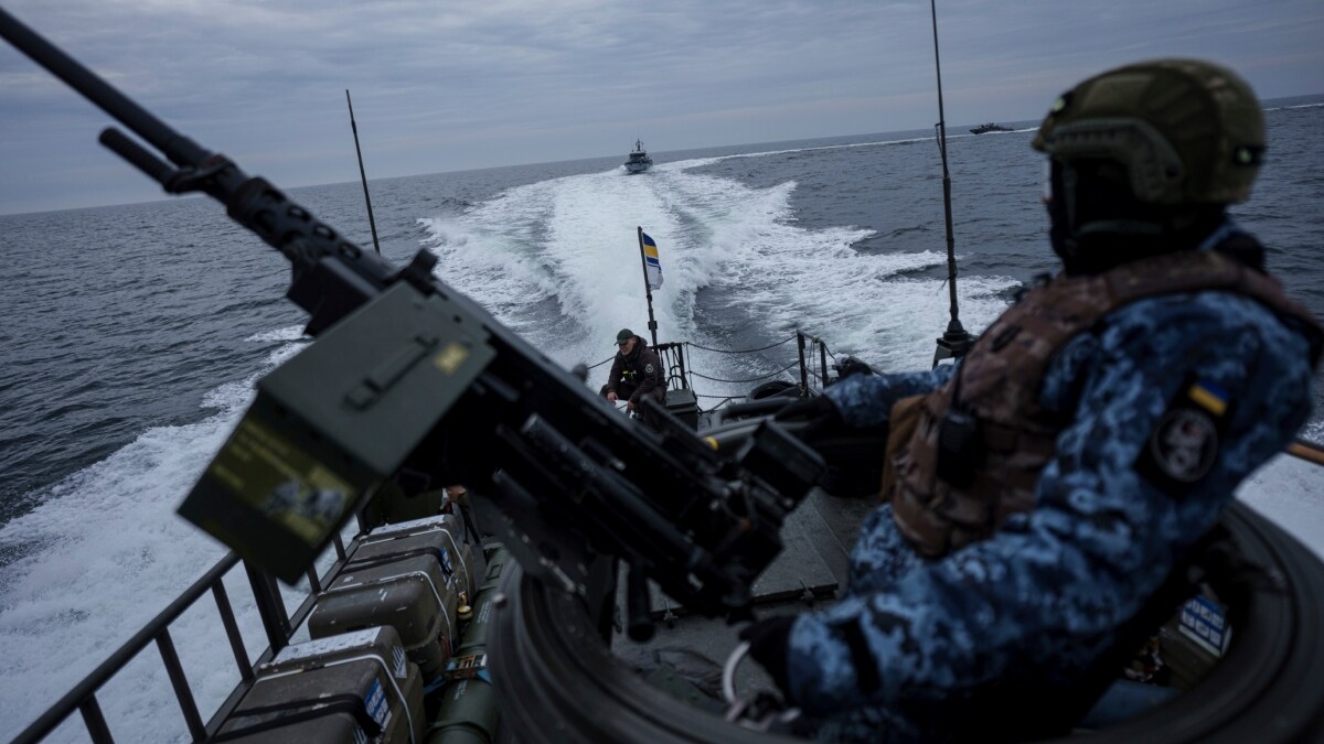 An Ukrainian serviceman of Military Naval Forces stands on a boat during patrol over Black Sea coast line of Odesa region | AP
