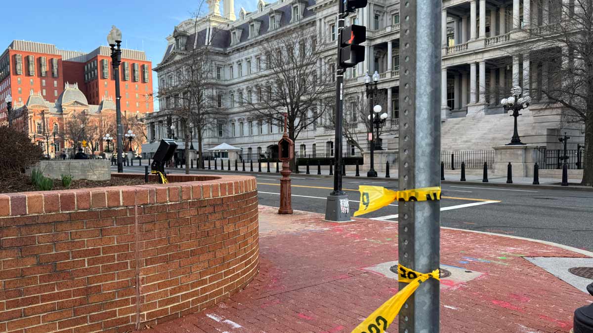 Police tape remains at the scene of an overnight shooting on a street bordering the White House complex, after Secret Service say they shot a man brandishing a firearm in Washington, DC | Reuters