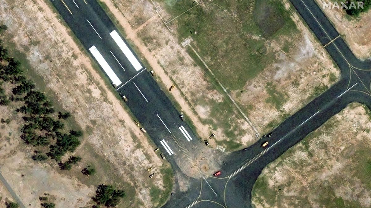 This handout satellite image courtesy of Maxar Technologies shows damage to runway and response crews at Pakistan Air Force base Mushaf in Sargodha, Pakistan on May 10 | AFP