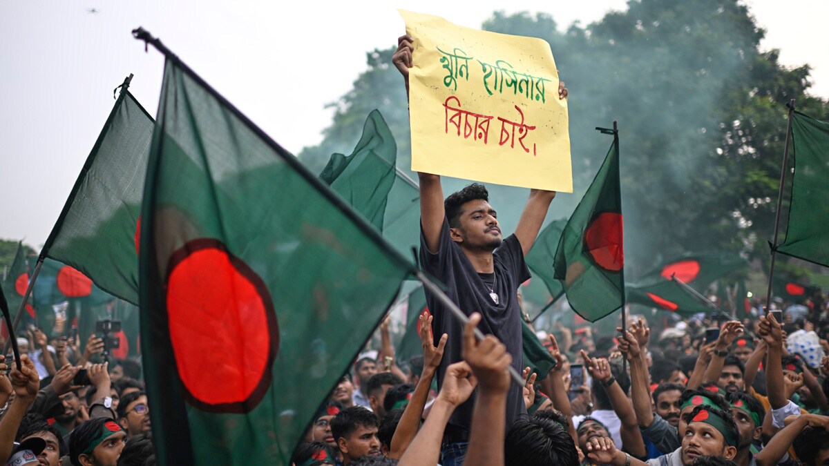 Students and locals shout slogans as they gather to commemorate "July Uprising Day" marking the anniversary of the fall of the Awami League government, in Dhaka, Bangladesh, Tuesday, Aug. 5, 2025. (AP Photo/Mahmud Hossain Opu)