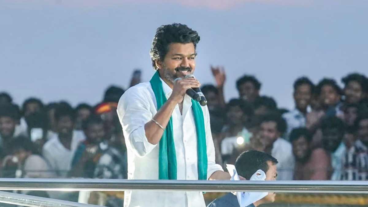 Actor and Tamilaga Vettri Kazhagam (TVK) founder Vijay greets the gathering during a public meeting, in Thiruvarur | PTI