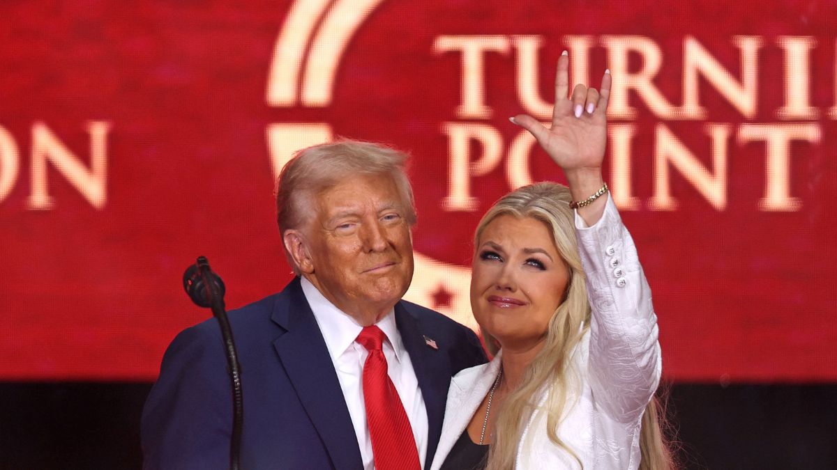 US President Donald Trump and Erika Kirk, Charlie Kirk's widow, gesture during the public memorial service for right-wing activist Charlie Kirk at State Farm Stadium in Glendale, Arizona | AFP