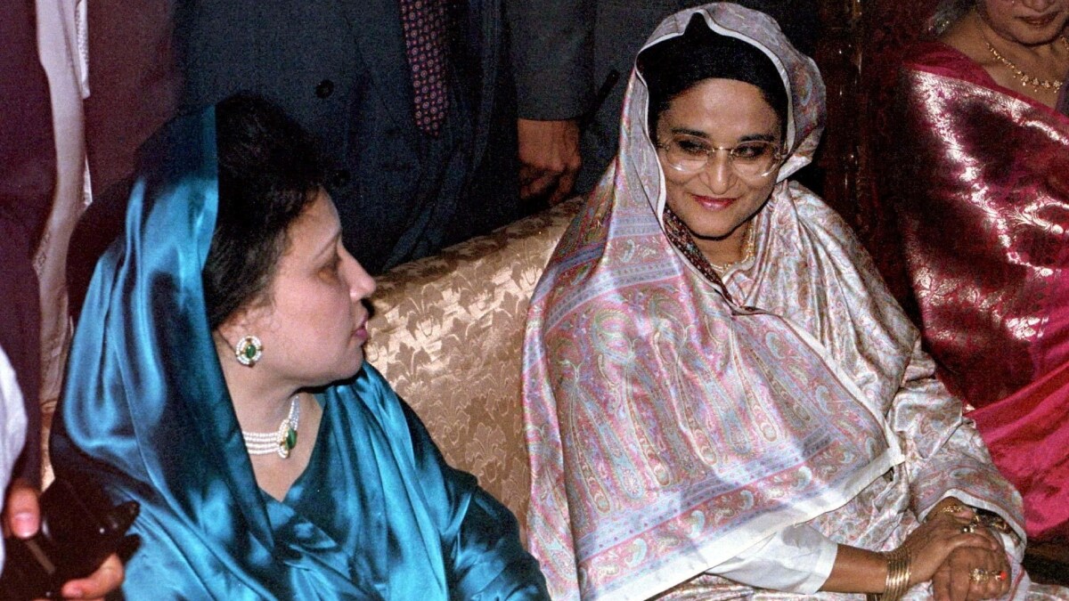 Bangladesh Prime Minister Sheikh Hasina and opposition leader Begum Khaleda Zia sit at a wedding reception for Khaleda's second son's Arafat Rahman March 28, 1997 | Reuters
