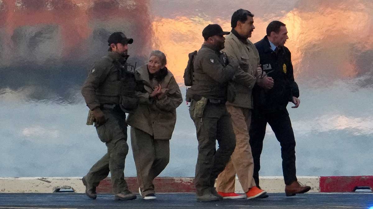Law enforcement officials move captured Venezuelan President Nicolas Maduro and his wife Cilia Flores out of a helicopter, as they head towards the Manhattan court | Reuters