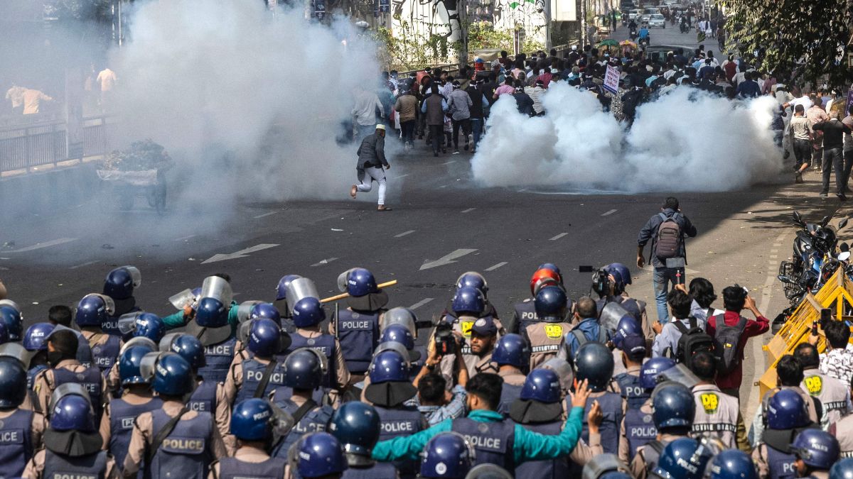 Police personnel fire tear gas shells to disperse protesters in Bangladesh | AFP