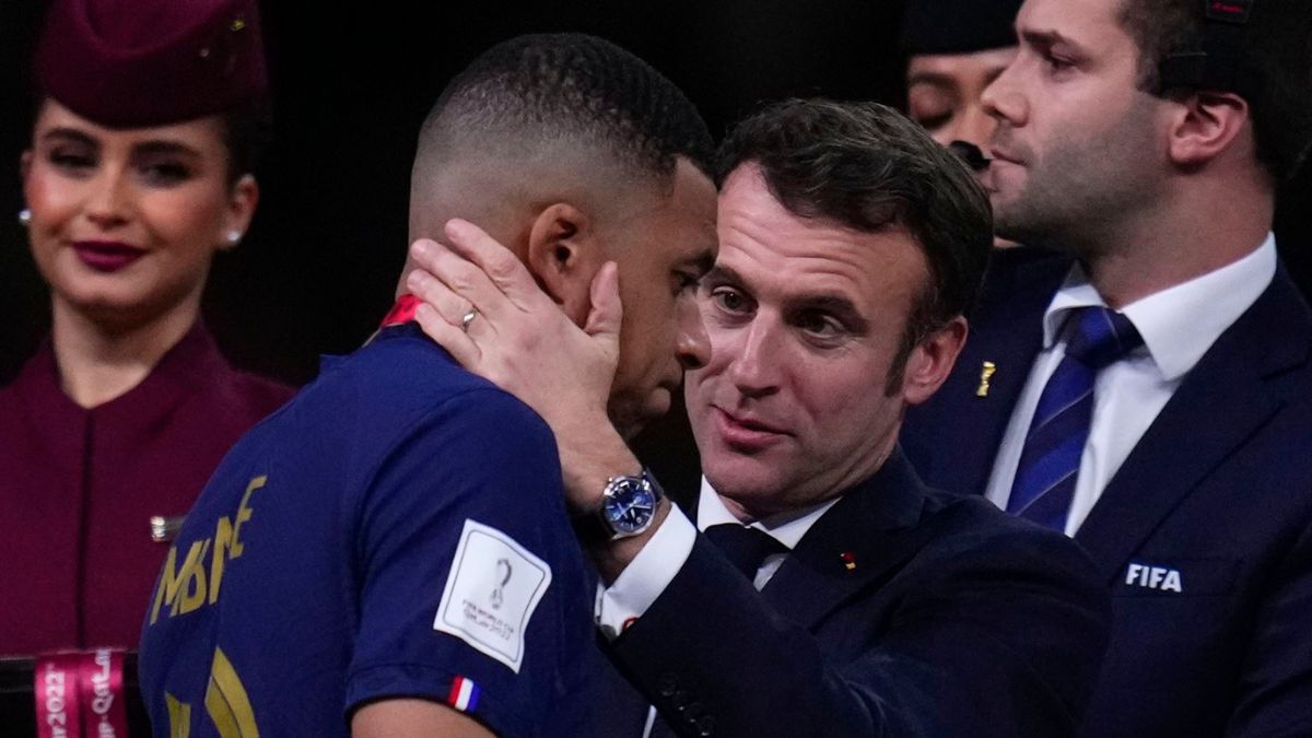 France's Kylian Mbappe is consoled by French President Emmanuel Macron after the World Cup final soccer match between Argentina and France at the Lusail Stadium in Lusail, Qatar, Dec 18, 2022 | Reuters