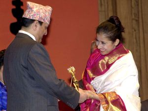 A 2003 photo of Nepal’s King Gyanendra Shah presenting an award to Manisha Koirala in Kathmandu | AP