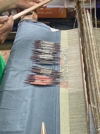 The wefting is done by men on a loom; a coloured extra weft is also added by hand, often that makes for a ‘kani’ weave