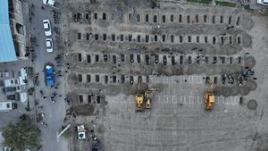 Graves dug for those killed in the strike on a school in Minab, Iran | Reuters