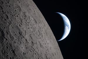 A crescent earth along the moon’s limb, as seen from the Orion spacecraft on April 6 | AFP