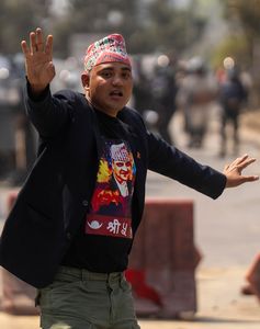 A monarchy supporter wearing a t-shirt with Gyanendra's image | AP